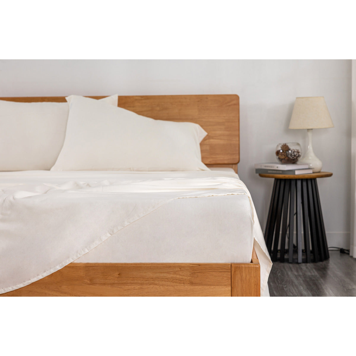 Close-up corner view of the footer area of the MLILY Soft Washed Sheet Set, white, showcasing the softness and fit for mattresses up to 16 inches tall.