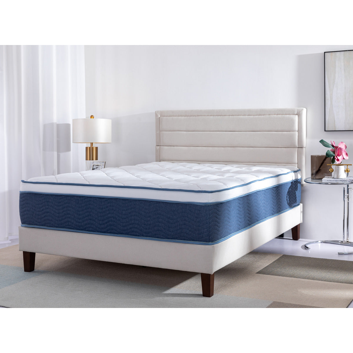 Corner view of the Doms Mattress Store ValueRest Innerspring Medium Plush 13" Mattress on a bed frame in a bedroom