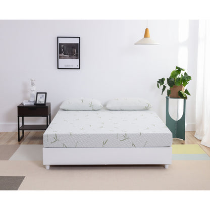 MLILY Dreamer Memory Foam Medium Firm 6" Mattress facing forward on a platform frame with two Dreamer pillows at the head part of the mattress, inside a bedroom.