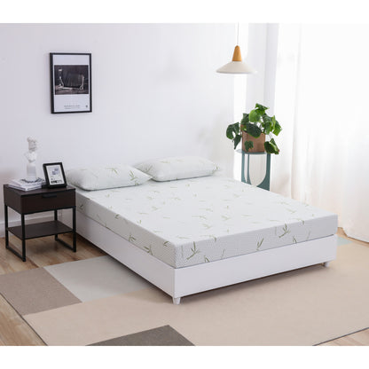 MLILY Dreamer Memory Foam Medium Firm 6" Mattress viewed from a corner angle, showing the side, corner, and front of the bed on a platform frame with two Dreamer pillows at the head of the mattress, inside a bedroom.