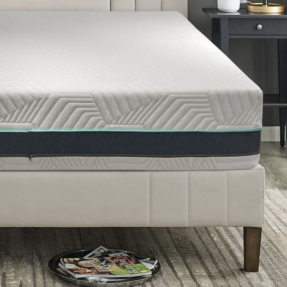 MLILY Essential Plus Memory Foam Medium Plush 12" Mattress showing a zoomed-in view of the front, with only half of the mattress visible, highlighting the detail of the mattress cover.