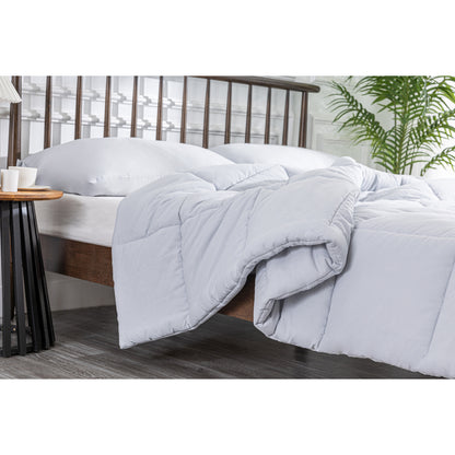 MLILY Soft Washed Down Alternative Comforter on a bed with a slight corner side view, showing a real-life, lived-in look, as if someone just got out of bed. The comforter is soft, inviting, and adds a cozy touch to the bedroom.