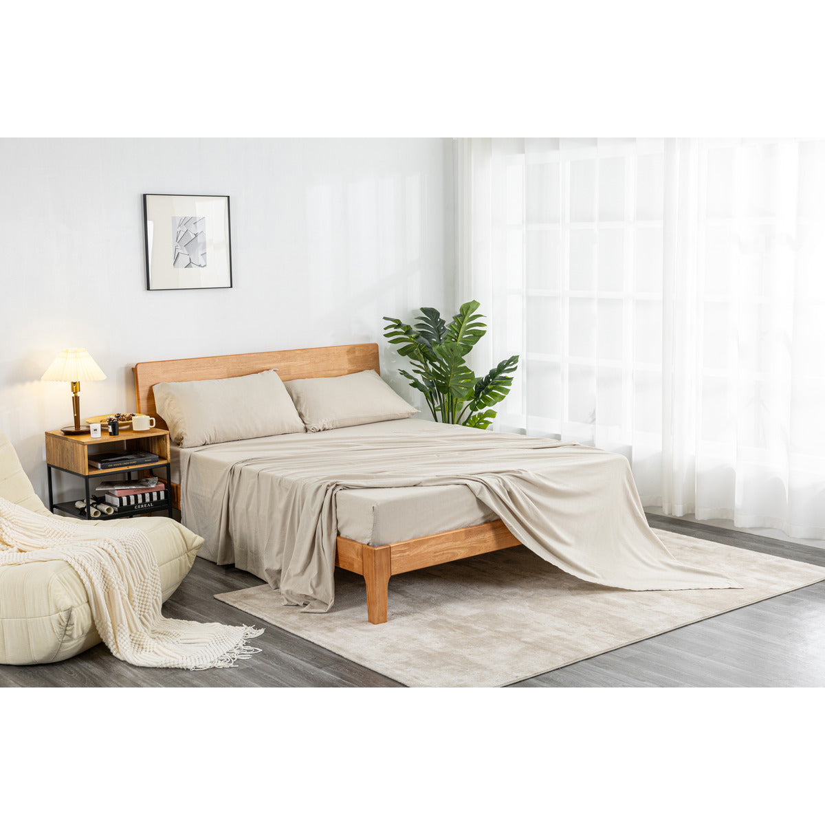 MLILY Soft Washed Sheet Set in beige, zoomed-out corner view, made halfway across a bed for decorative purposes, in a decorated bedroom.