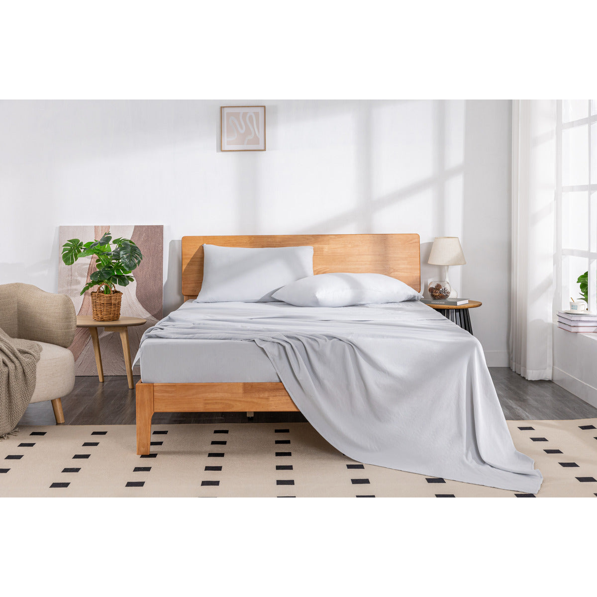 MLILY Soft Washed Sheet Set in grey, halfway made on a bed for decorative purposes.