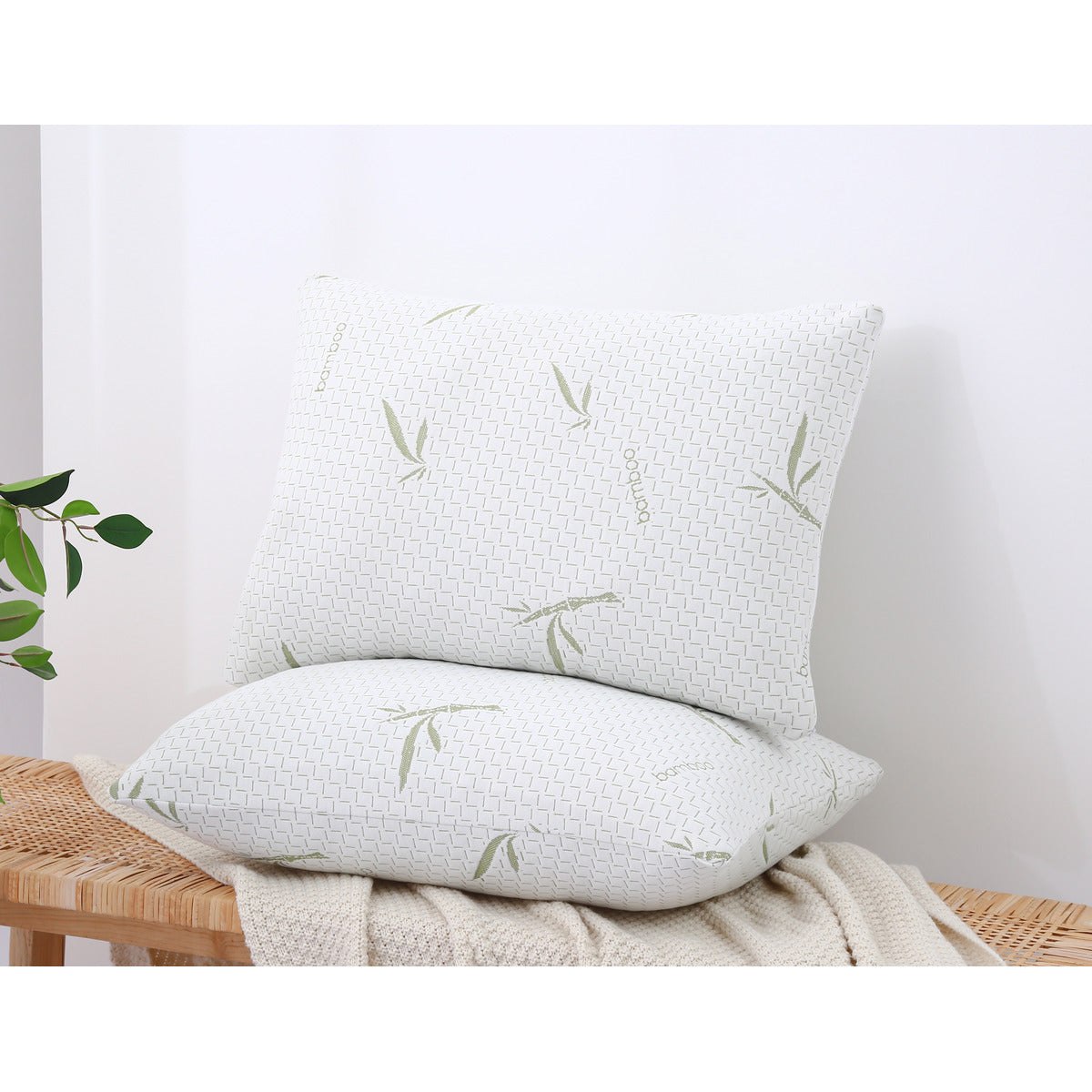One MLILY Dreamer Pillow – Free Realtor Edition (S&H Applies) laying flat and the other sitting on top facing forward, almost looks like a seat position, placed on a throw blanket with a surface underneath.