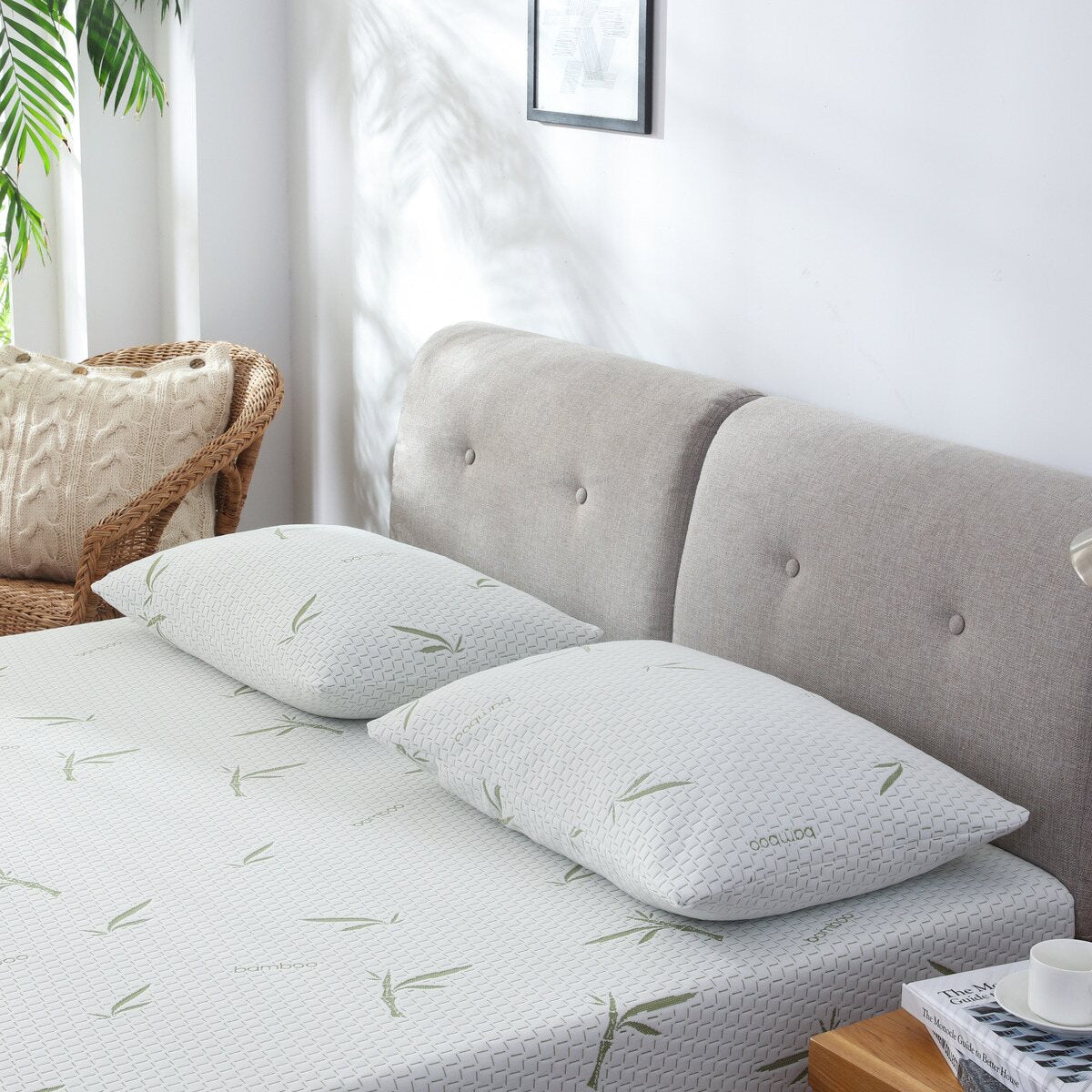 Two MLILY Dreamer Pillows – Free Realtor Edition (S&H Applies) laying flat at the head of a Dreamer mattress, on top of a platform bed frame, inside a decorated bedroom.