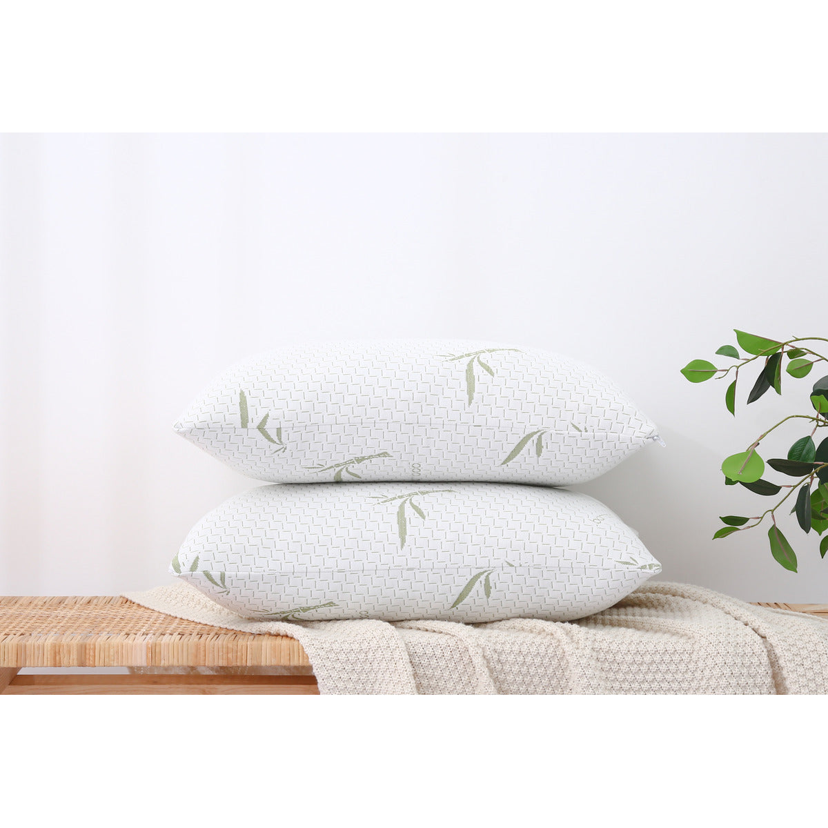 Two MLILY Dreamer Pillows – Free Realtor Edition (S&H Applies) stacked on top of each other, placed on a throw blanket with a surface underneath.